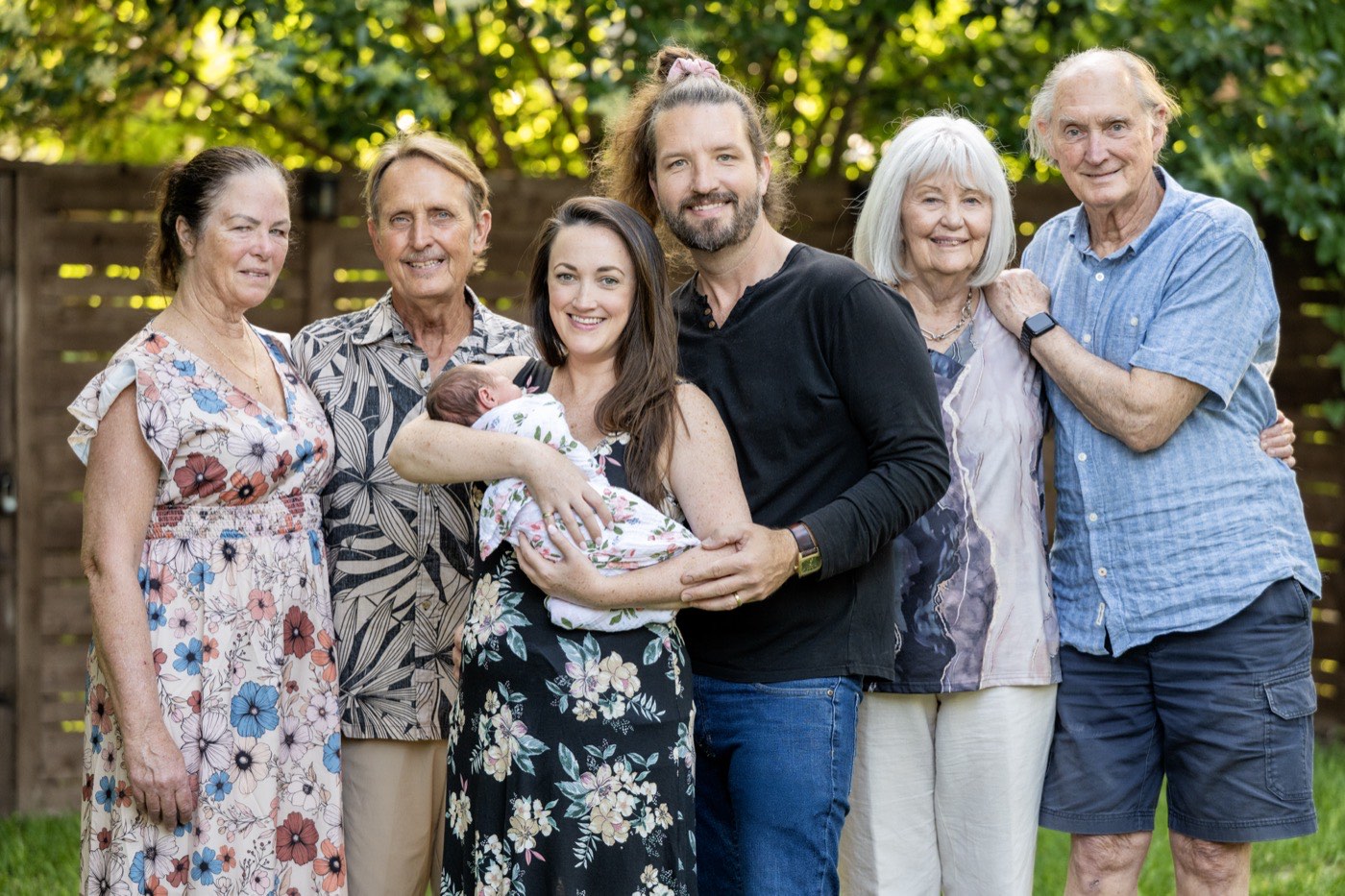 Erick Johnson with his wife, newborn daughter Isabella, and both sets of grandparents